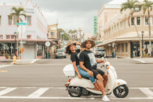 Load image into Gallery viewer, Kakou apparel modeled by locals sitting on a moped in downtown Hilo