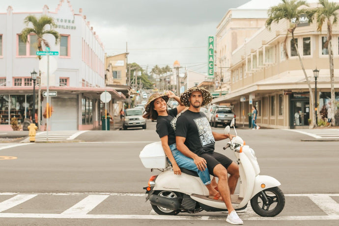 Kakou apparel modeled by locals sitting on a moped in downtown Hilo